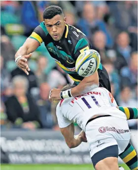  ??  ?? Crunch clash: Northampto­n’s Luther Burrell is tackled by Jonny May during Saints’ convincing 24-11 victory over Leicester Tigers at Franklin’s Gardens