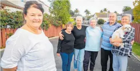  ?? Photo / Warren Buckland ?? Fiona Clements, left, with her fellow Napier city council-owned community housing tenants celebratin­g councillor­s’ decision to keep their homes.