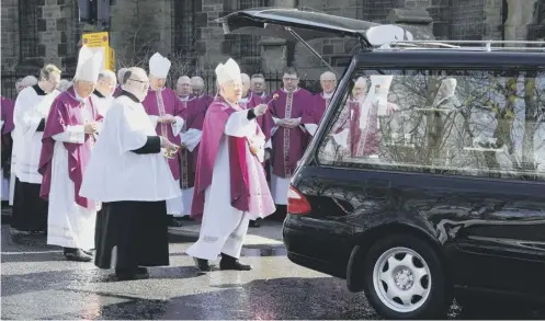  ?? PICTURE: OWEN HUMPHREYS/PA ?? 0 The coffin of Cardinal Keith O’brien leaves the Church of St Michael after his funeral service yesterday