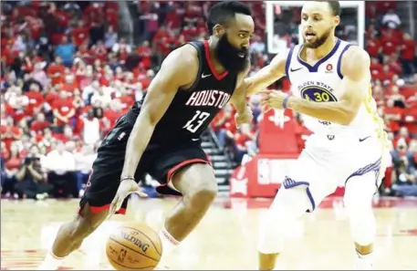  ?? AFP ?? James Harden of the Houston Rockets drives against Stephen Curry of the Golden State Warriors in Game 2 of the Western Conference finals of the 2018 NBA Playoffs on Wednesday at Toyota Center in Houston, Texas.