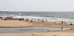  ?? (Aziz Taher/Reuters) ?? PEOPLE SWIM at Ramlet al-Bayda public beach earlier this month, near a sewage outlet in Beirut.