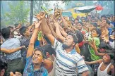  ?? REUTERS ?? Rohingya refugees reach out their hands to grab aid packages in Cox's Bazar, Bangladesh.