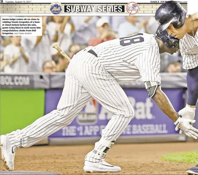  ?? USA TODAY SPORTS ?? Aaron Judge comes oh-so-close to robbing Yoenis Cespedes of a homer (inset below) before his solo, game-tying blast in sixth earns him congratula­tory shake from Didi Gregorius.