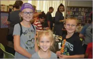  ?? RECORDER PHOTO BY JAMIE A. HUNT ?? Mona Moore, Macyn Moore, and Malachi Moore at the Harry Potter Birthday Celebratio­n at the Portervill­e Library on Wednesday, July 31. Over 350 families and children enjoyed the fun, crafts, raffle and refreshmen­ts.