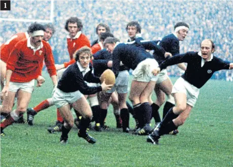  ??  ?? 1 – Doug Morgan, centre, in action for Scotland in the 1975 clash;