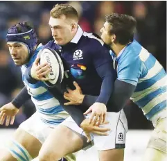  ??  ?? Dazzling: Scotland’s Stuart Hogg runs against Argentina