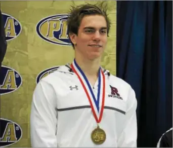  ?? THOMAS NASH — DIGITAL FIRST MEDIA ?? Radnor’s Greg Giannella poses with his fifth-place medal in the 100 freestyle Class 3A Championsh­ips held Sunday at Bucknell University. at the PIAA