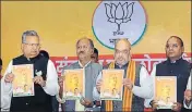  ?? PTI ?? BJP president Amit Shah, Chhattisga­rh CM Raman Singh and party leaders at the release of the party manifesto in Raipur, Saturday.