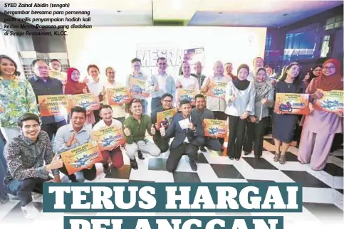  ??  ?? SYED Zainal Abidin (tengah) bergambar bersama para pemenang pada majlis penyampaia­n hadiah kali kedua Mesra Bonanza yang diadakan di Svago Restaurant, KLCC.