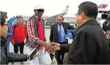  ??  ?? Guest appearance Former NBA star Dennis Rodman is greeted by the Vice- Minister of North Korea’s Sports Ministry, Son Kwang- ho, on arrival at Pyongyang airport yesterday.
AP