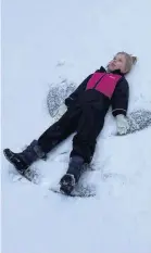  ??  ?? ●● Grace Salmon making snow angels