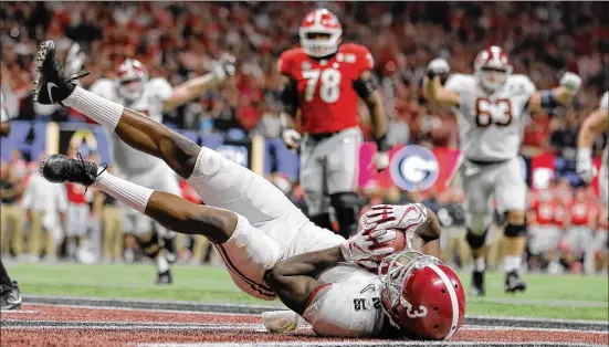  ?? ALYSSA POINTER / ALYSSA.POINTER@AJC.COM ?? Alabama wide receiver Calvin Ridley (3) comes down with a touchdown pass during the fourth quarter of the College Football Playoff National Championsh­ip in Atlanta on Jan. 8. Ridley leaves Alabama second all-time to Amari Cooper in career receptions...