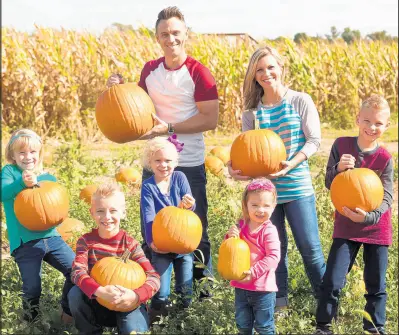  ?? HARVEST TYME PUMPKIN PATCH ?? Families enjoy picking pumpkins at the Harvest Tyme Pumpkin Patch in Lowell.