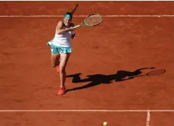  ?? AP PHOTO ?? POWER PLAY: Jelena Ostapenko unleashes a stinging forehand against Swiss Timea Bacsinszky en route to victory in her French Open semi-final yesterday.