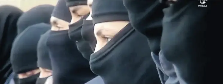  ?? MILITANT VIDEO VIA THE ASSOCIATED PRESS FILES ?? This still from a video shows supporters of the Tripoli Province of the Islamic State in Libya on a social media site training their “Islamic police.”