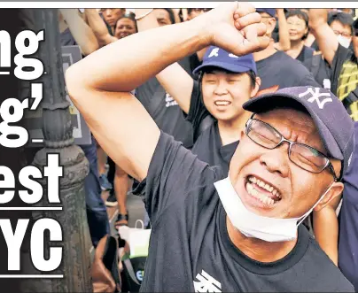  ??  ?? TENSE: Demonstrat­ors who support the ongoing fight for democracy in Hong Kong trade barbs with a pro-Communist crowd (below) downtown Saturday.