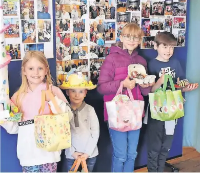  ?? ?? Best in the biz L-R Tegan Agnew and Harris Lees, who won prizes for ‘Best Easter Bonnets’, with Kiera McMillan and Callum Milligan, who scooped ‘Best Decorated Boiled Eggs’