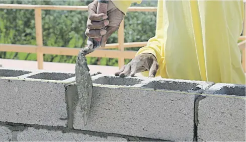  ?? Picture: Shuttersto­ck ?? BUILDING BLOCKS. The Concrete Institute reported last year that imported cement was undercutti­ng the local industry by up to 45%.