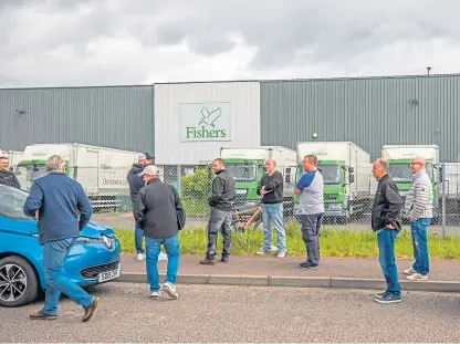  ?? Picture: Steve MacDougall. ?? Staff await news outside the Ruthvenfie­ld Avenue plant yesterday.