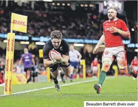  ?? ?? Beauden Barrett dives over