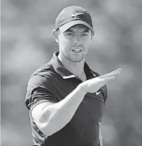  ?? [ADAM CAIRNS/DISPATCH] ?? Rory Mcilroy hits on the driving range during a practice round for the Memorial Tournament on Wednesday at Muirfield Village Golf Club. He is in danger of losing his No. 1 world ranking.