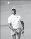  ?? JON SUPER/AP ?? Tiger Woods, who hasn’t competed since the U.S. Open, practices at Royal Portrush Golf Club on Monday.