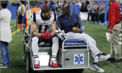  ?? DUANE BURLESON — THE ASSOCIATED PRESS ?? New England receiver Julian Edelman (11) is taken off the field on a cart Friday in Detroit.