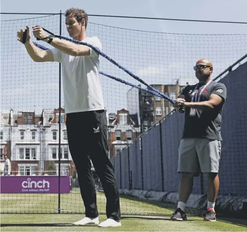  ??  ?? 0 Andy Murray does stretching exercises as he practises ahead of today’s first-round match against France’s Benoit Paire