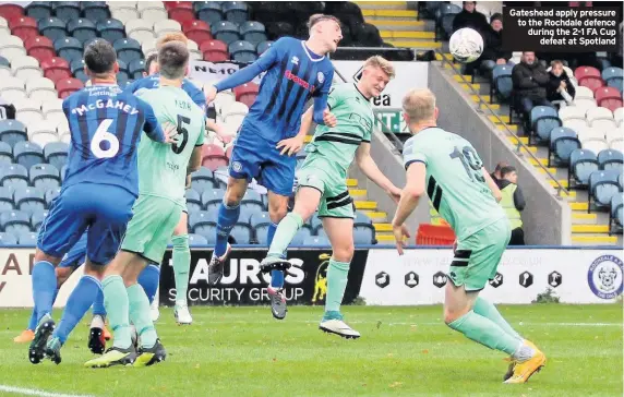 ??  ?? Gateshead apply pressure to the Rochdale defence during the 2-1 FA Cup defeat at Spotland