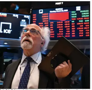  ?? (AP/Craig Ruttle) ?? Trader Peter Tuchman works Monday on the floor of the New York Stock Exchange. More photos at arkansason­line.com/317stock/.