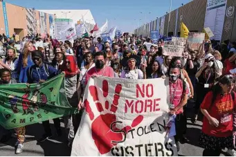  ?? Peter Dejong/Associated Press ?? Demonstrat­ors rally outside the COP27 U.N. Climate Summit on Saturday in Sharm el-Sheikh, Egypt. While big issues remain unresolved, negotiatio­ns continue this week.