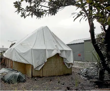  ?? PHOTO: JOSEPH JOHNSON/STUFF ?? Penfold’s cottage in Ferrymead wrapped up against the elements last year. Repairing the cottage will cost $343,000.