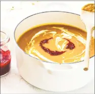  ??  ?? A Roasted Harvest Vegetable Soup with Cranberry Coulis, from “The Cranberry Cookbook.” Roasted