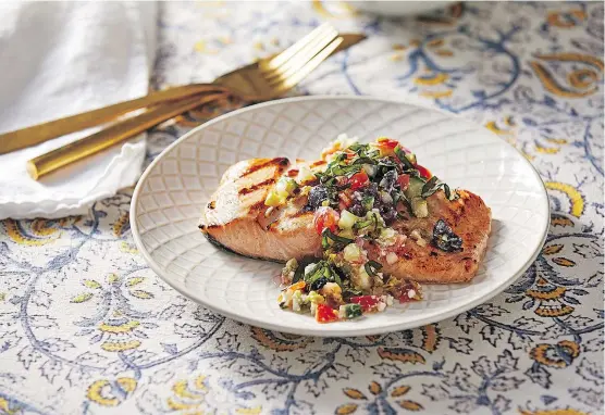  ?? TOM MCCORKLE/WASHINGTON POST) ?? Grilled salmon with Greek salad salsa.