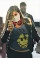  ?? Kent Nishimura Los Angeles Times ?? TRAVELERS at LAX wear face masks, one tool people are using in the fight against COVID-19.