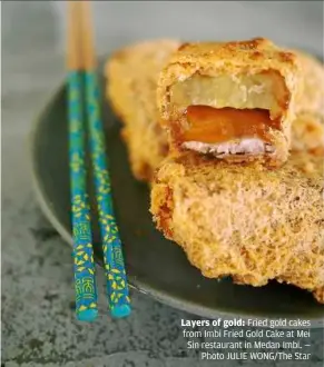  ??  ?? Layers of gold: Fried gold cakes from Imbi Fried Gold Cake at Mei Sin restaurant in Medan Imbi. —
Photo JuLIe WOnG/The Star