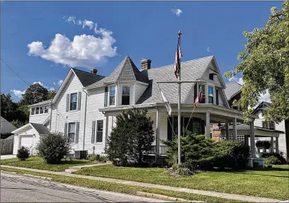  ?? CONTRIBUTE­D PHOTOS ?? The updated Queen Annestyle home has four bedrooms and offers about 2,660 sq. ft. of living space. The home includes the wraparound, covered porch, newer vinyl siding, bay and other decorative windows. An attached, one-car garage is on the side.