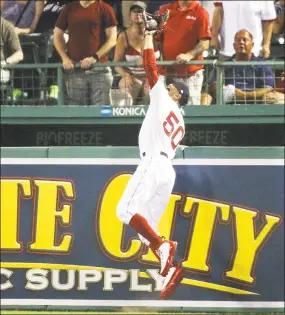  ?? Adam Glanzman / Getty Images ?? Mookie Betts of the Red Sox makes a leaping catch at the wall, robbing Nomar Mazara of the Rangers of a home run in the fifth inning of Tuesday’s game in Boston,