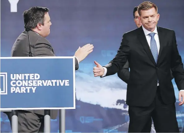  ?? GAVIN YOUNG/FILES ?? Brian Jean gives a thumbs up onstage after shaking hands with newly chosen United Conservati­ve Party Leader Jason Kenney in Calgary last October. “I believe now is an important time in my life to draw closer to my family, my kids and my grandchild­ren,”...