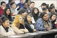  ??  ?? MORE THAN 100 top students of color at Manual Arts listen to Napolitano’s recruiting pitch.