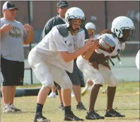  ??  ?? Yellow Jackets line up in a play during spring practice in May. Rockmart football players will get their first chance at full practice starting on Aug. 1.