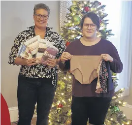  ?? CONTRIBUTE­D ?? Julie Crouse, from the NSCC, left, and Lotus Centre administra­tive assistant Sandi Dunbar display some of the underwear donated to the centre. The items will be distribute­d to women in need.