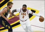  ?? PHIL LONG/ ASSOCIATED PRESS ?? Cleveland’sAndre Drummonddr­ives past Indiana’s Domantas Sabonis during a preseason game. He and fellownewl­y acquired center JaVale McGee are expected to be impact players this season.