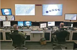  ??  ?? FLORIDA: Members of the 601st Air Operations Center watch Santa fly around the world on Christmas Eve with their NORAD Santa tracker in Panama City, Florida.