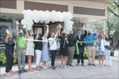  ?? PHOTO PROVIDED BY THE SARATOGA COUNTY CHAMBER OF COMMERCE ?? A ribbon-cutting ceremony is held to celebrate the grand opening of Toga Heritage’s new location at 322 Broadway in downtown Saratoga Springs.