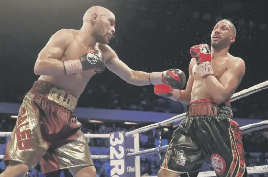  ??  ?? 2 American Caleb Truax, left, lands a punch on his way to defeating Britain’s James Degale in the IBF world supermiddl­eweight championsh­ip fight at London’s Copper Box on Saturday night. Degale has hinted he may now retire from the sport.