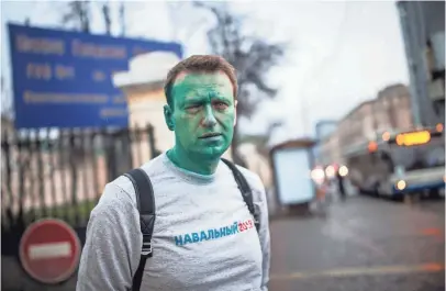  ??  ?? Russian opposition leader Alexei Navalny says unknown attackers doused him with green antiseptic April 27 outside a conference in Moscow. Navalny made a documentar­y about government corruption.