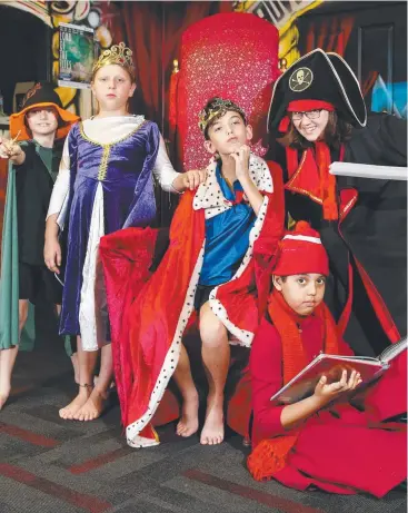  ??  ?? GIVE IT A GO: The Young Company Theatre performers (from left) Wizard Evan Porter, queen Marta Rubulis, king Aidan Stemp, librarian Aidan El Majda and pirate Ava Bradley. Picture: BRENDAN RADKE