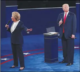  ?? DOUG MILLS / THE NEW YORK TIMES ?? Hillary Clinton and Donald Trump are seen in October 2016 during their debate at Washington University in St. Louis, Mo. Now in 2017, if Attorney General Jeff Sessions or his deputy authorizes a new investigat­ion of Clinton, it would undermine...