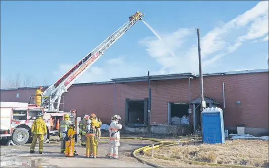  ?? LAWRENCE POWELL ?? Bridgetown firefighte­rs, with help from department­s across Annapolis County, were quick to extinguish a fire at the West Nova Agro hay pellet and fire log plant in Centrelea early last Tuesday morning. It appears three pallets of fire logs manufactur­ed...